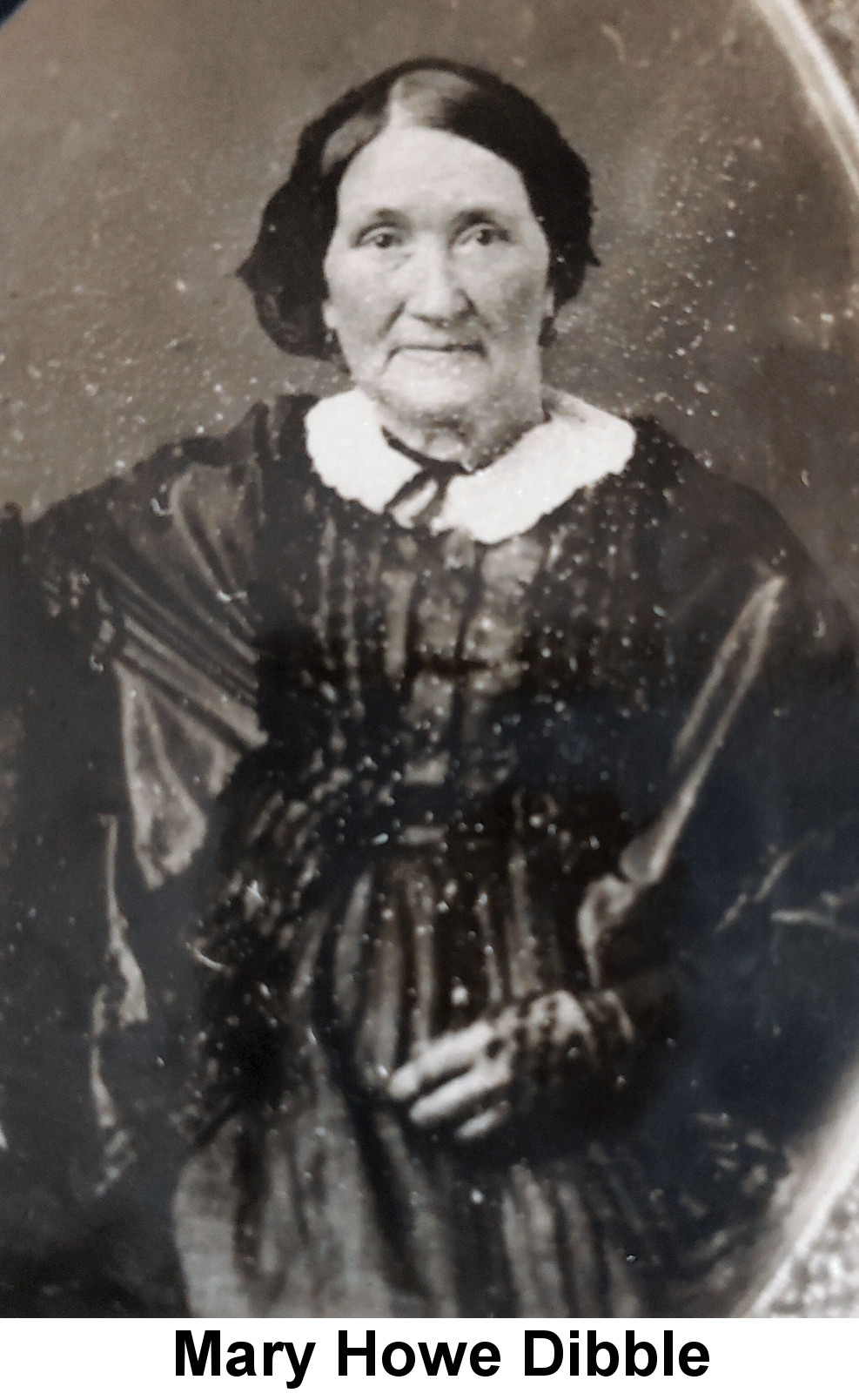 IMAGE/PHOTO: Mary Howe Dibble: Black and white portrait photo of a seated elderly woman with short hair pulled back and parted in the middle, wearing a dark heavily beaded satin dress with a white collar.